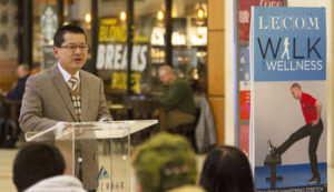 Dr. James Lin of LECOM Presenting at podium at the Millcreek Mall